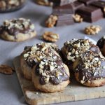 Chocolate and walnut cookies on a wooden desk