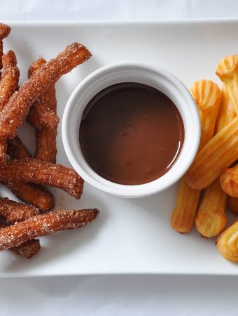 Fried and baked churros with chocolate sauce