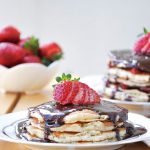 Fluffy American Pancakes stacked with hazelnut spread