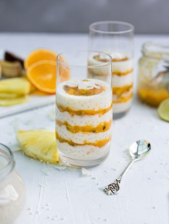 Coconut Tapioca Pudding with Passion Furit, mangoes,, pineapple and citrus sauce in a glass