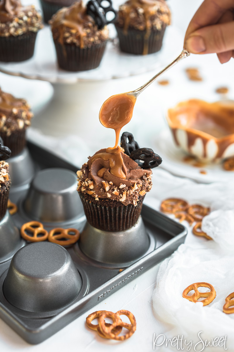 Salted Caramel filled Chocolate Cupcakes with whipped milk chocolate ganache and chocolate butterfly pretzels