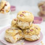 Bitten ice cream cookie sandwiches with ruby and white chocolate stacked on top of each other