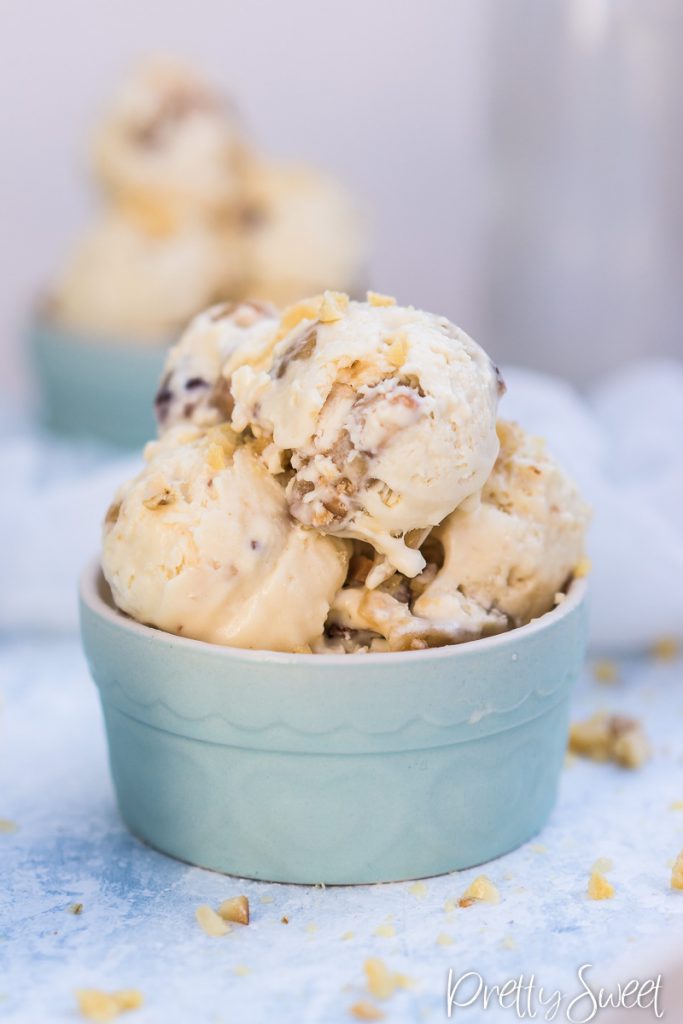 scooped home-made ice cream with macadamia nut brittle in a blue ramkein