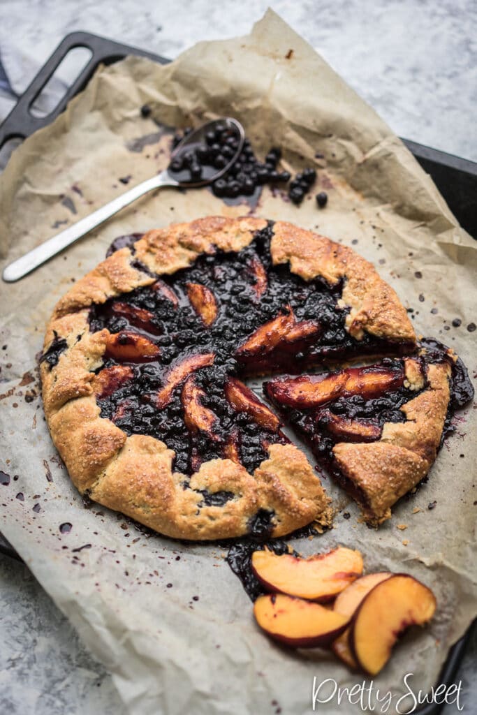 Baked peach blueberry galette with ginger photograpedh from 45° angle