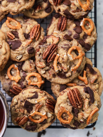 pretzel chocolate chip pecan cookies stacked on a rack flat lay