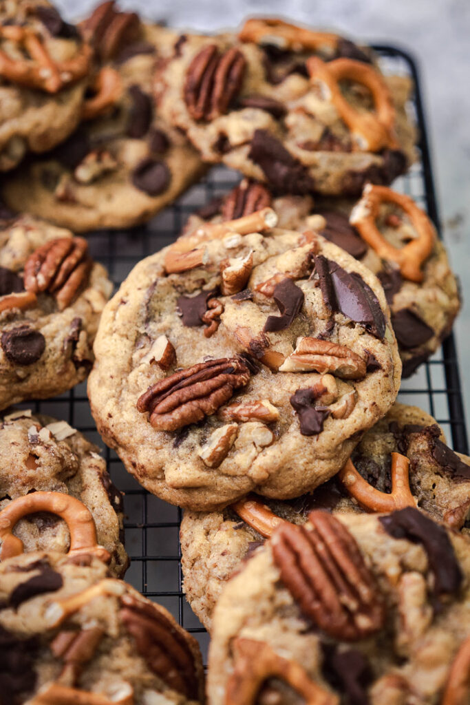 pecan chocolate chip cookies on a rack up close