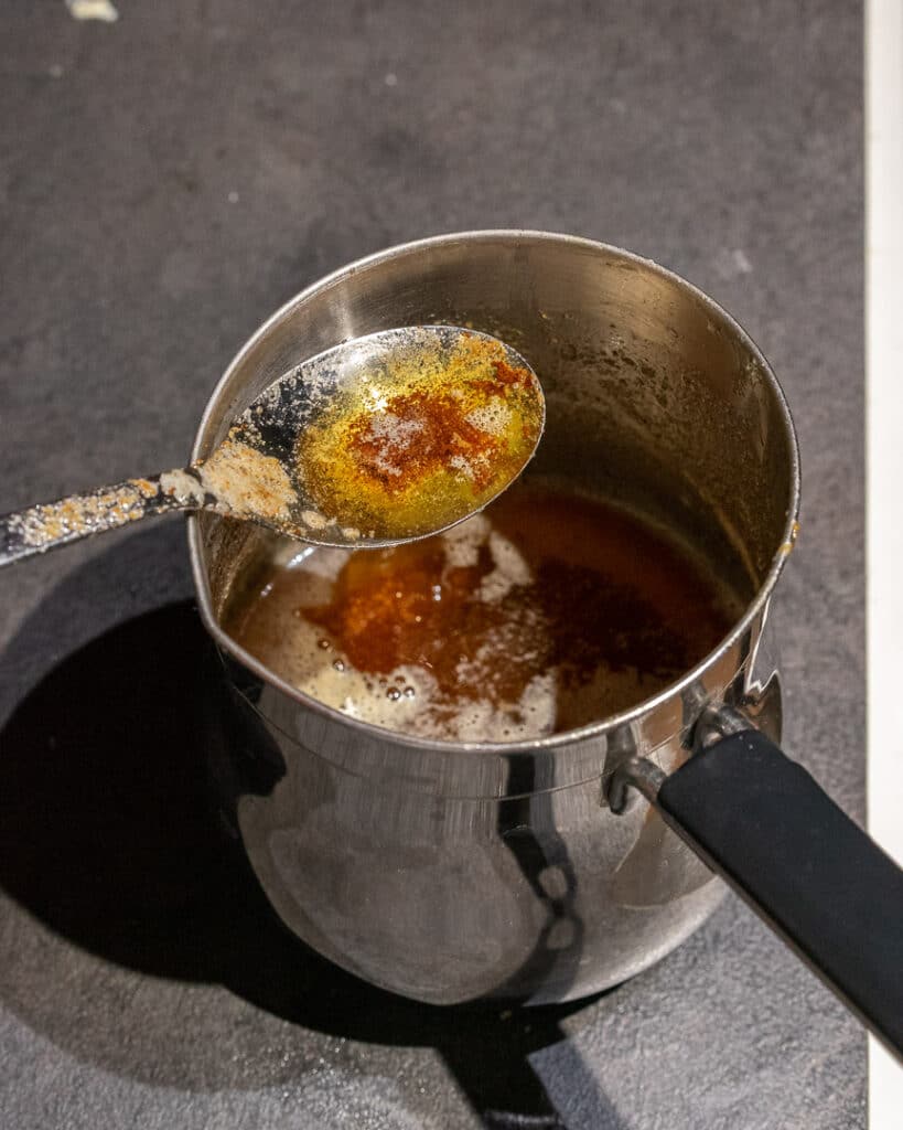 browned butter in a pot and on a spoon