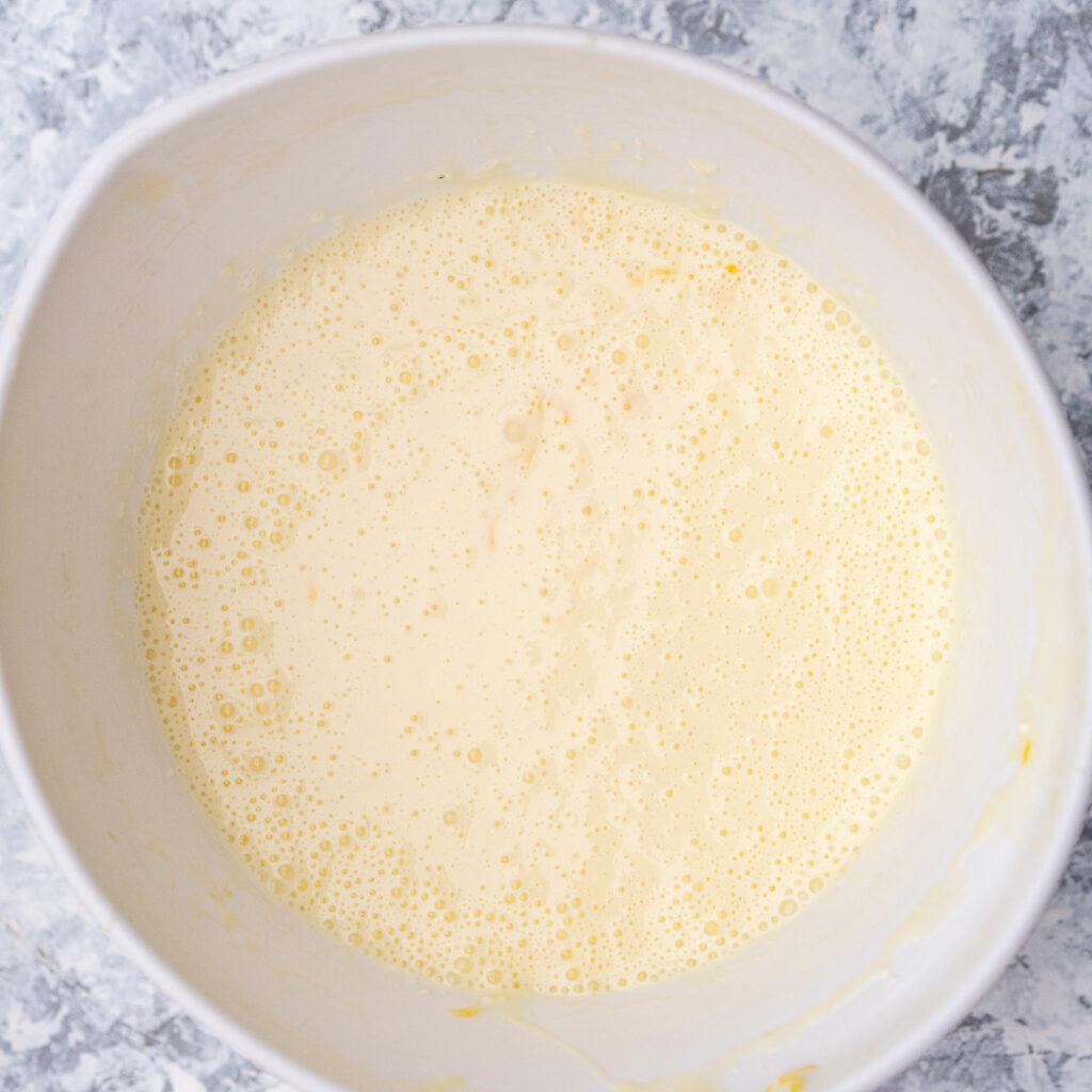 lemon cheesecake filling in a white bowl